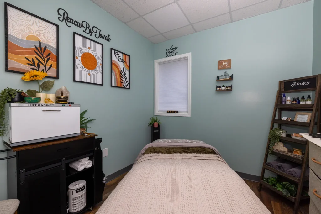 Treatment table and wall art inside the Concord studio